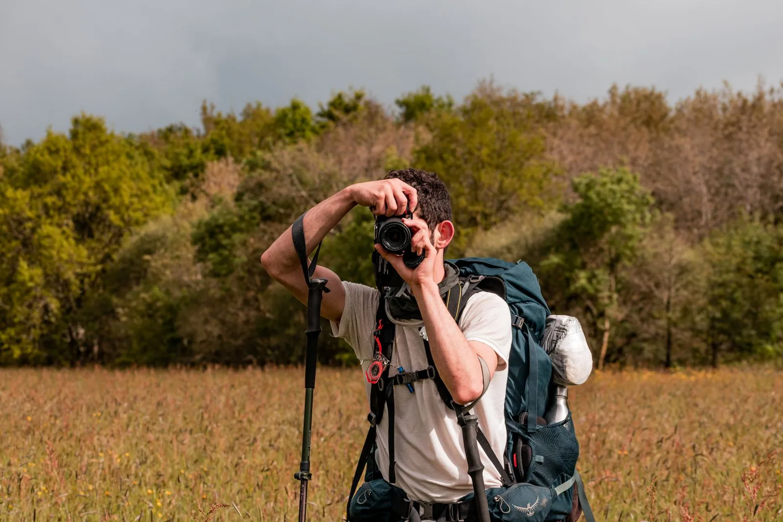 Photographer capturing nature in a field near Saint-Philbert-de-Grand-Lieu, France.